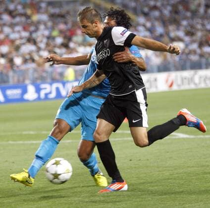 MALAGA (Spain), 18 09 2012-CHAMPION LEAGUE. El jugador del Malaga CF, Joaquin; y el del Zenit Petersburg, Bruno Alves, Estadio La Rosaleda de Malaga, 