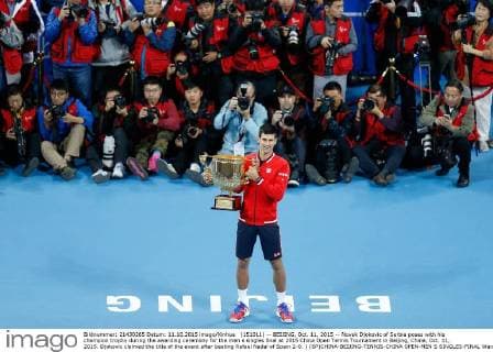 (151011) -- BEIJING, Oct. 11, 2015 -- Novak Djokovic of Serbia poses with his champion trophy during the awarding ceremony for the men s singles final at 2015 China Open Tennis Tournament in Beijing, China, Oct. 11, 2015. Djokovic claimed the title of the event after beating Rafael Nadal of Spain 2-0. ) (SP)CHINA-BEIJING-TENNIS-CHINA OPEN-MEN S SINGLES-FINAL WangxLili