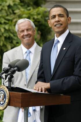 May 11, 2009 - Washington, District of Columbia, USA - UNC Men s Basketball Head Coach ROY WILLIAMS listens as President BARACK OBAMA speaks to the Media outside of the White House. President Obama hosted the University of North Carolina Basketball Team at the White House to congratulate them on their NCAA College League USA Tournament Victory. (Credit Image:  - ZUMA 20090511_ber_b21_026 Copyright: xJamesxBergliex