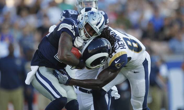 August 12, 2017 - Los Angeles, CA, USA - LOS ANGELES, CA - AUGUST 12, 2017 - Dallas Cowboys Lance Lenior is hit by Los Angeles Rams Temarrick Hemingway on a kick return in the first quarter at the Los Angeles Memorial Coliseum. NFL American Football Herren USA Preseason 2017: Rams 13:10 Cowboys - ZUMAs44_ 20170812_zaf_s44_020 Copyright: xK.C.xAlfredx