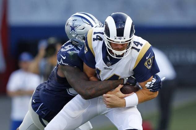 August 12, 2017 - Los Angeles, CA, USA - LOS ANGELES, CA - AUGUST 12, 2017 - Los Angeles Rams quarterback Sean Mannion is sacked by Dallas Cowboys Taco Charlton in the first quarter at the Los Angeles Memorial Coliseum. NFL American Football Herren USA Preseason 2017: Rams 13:10 Cowboys - ZUMAs44_ 20170812_zaf_s44_021 Copyright: xK.C.xAlfredx