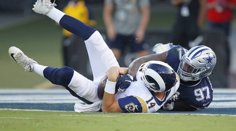 August 12, 2017 - Los Angeles, CA, USA - LOS ANGELES, CA - AUGUST 12, 2017 - Los Angeles Rams quarterback Sean Mannion is sacked by Dallas Cowboys Taco Charlton in the first quarter at the Los Angeles Memorial Coliseum. NFL American Football Herren USA Preseason 2017: Rams 13:10 Cowboys - ZUMAs44_ 20170812_zaf_s44_022 Copyright: xK.C.xAlfredx