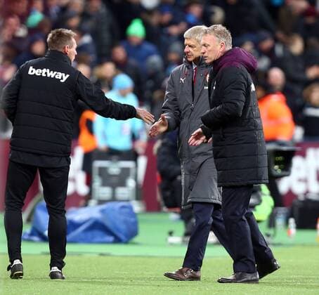 December 13, 2017 - London, United Kingdom - L-R Joint Assistant Manager Stuart Pearce shanks hands with Arsenal manager Arsene Wenger and West Ham United manager David Moyes. during Premier League match between West Ham United against Arsenal at The London Stadium, Queen Elizabeth II Olympic Park, London, Britain - 13 Dec 2017 West Ham United v Arsenal - Premier League  - ZUMAn230 20171213_zaa_n230_520 Copyright: xKieranxGalvinx