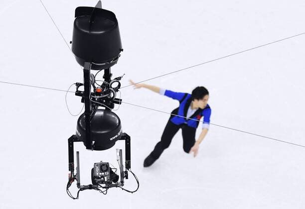 PyeongChang 2018 - Highlights der Olympischen Spiele Pyeongchang Olympics Japanese figure skater Keiji Tanaka performs beneath a special device called the spider cam at the venue of the at the Pyeongchang Olympics in Gangneung, South Korea, on Feb. 12, 2018.