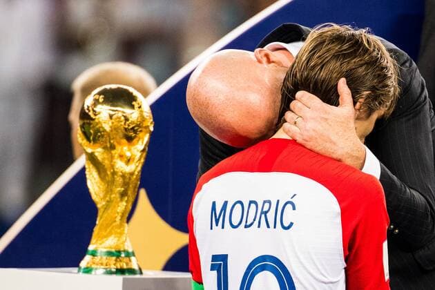 Sport Themen der Woche KW28 Sport Bilder des Tages 180715 Luka Modric of Croatia walks by the trophy and gets a hug by FIFA president Gianni Infantino during the medal ceremony after the FIFA World Cup WM Weltmeisterschaft Fussball final match between France and Croatia on July 15, 2018 in Moscow. Photo: Petter Arvidson BILDBYR?N kod PA 92087 Copyright: PETTERxARVIDSON BB180715PA424