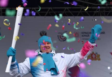 YEKATERINBURG, RUSSIA - NOVEMBER 17, 2018: Sergei Chepikov of the Sverdlovsk Region Legislative Assembly holds the torch with the flame of the 2019 Winter Universiade scheduled to start on March 2, 2019, in Krasnoyarsk. Donat Sorokin TASS  TS097D38