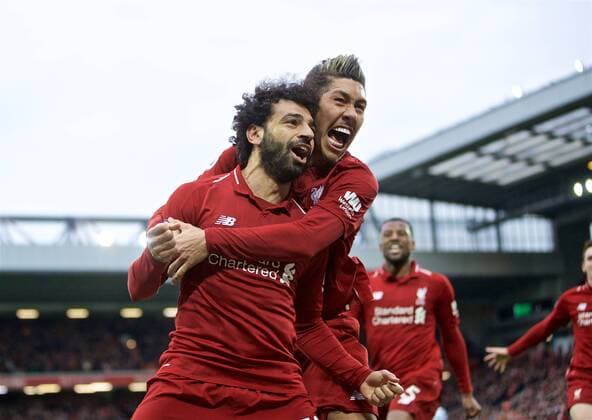 Sport Themen der Woche KW13 Sport Bilder des Tages (190401) -- LIVERPOOL, April 1, 2019 (Xinhua) -- Liverpool s Mohamed Salah (L) celebrates with teammate Roberto Firmino after forcing an own-goal during the English Premier League match between Liverpool and Tottenham Hotspur at Anfield in Liverpool, Britain, on March 31, 2019. Liverpool won 2-1. (Xinhua) FOR EDITORIAL USE ONLY. NOT FOR SALE FOR MARKETING OR ADVERTISING CAMPAIGNS. NO USE WITH UNAUTHORIZED AUDIO, VIDEO, DATA, FIXTURE LISTS, CLUB LEAGUE LOGOS OR LIVE SERVICES. ONLINE IN-MATCH USE LIMITED TO 45 IMAGES, NO VIDEO EMULATION. NO USE IN BETTING, GAMES OR SINGLE CLUB LEAGUE PLAYER PUBLICATIONS. (SP)BRITAIN-LIVERPOOL-FOOTBALL-ENGLISH PREMIER LEAGUE-LIVERPOOL VS TOTTENHAM HOTSPUR