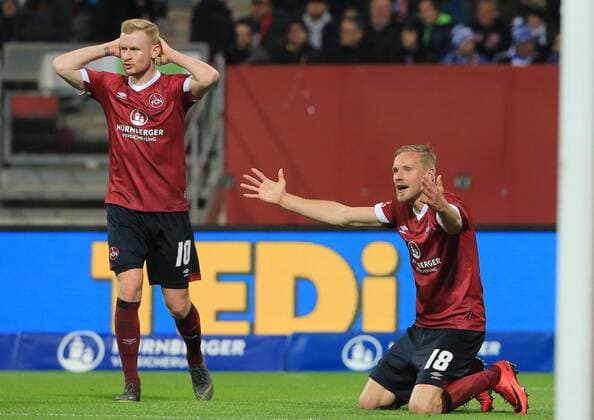 Sport Themen der Woche Sport Bilder des Tages 12.04.2019, 1. Bundesliga, 1.FC Nuernberg vs Schalke 04, Max Morlock Stadion, Fussball, im Bild: Sebastian Kerk ( 1.FC Nuernberg ) und Hanno Behrens ( 1.FC Nuernberg ) nach ungueltiges Tor DFL REGULATIONS PROHIBIT ANY USE OF PHOTOGRAPHS AS IMAGE SEQUENCES AND OR QUASI VIDEO.