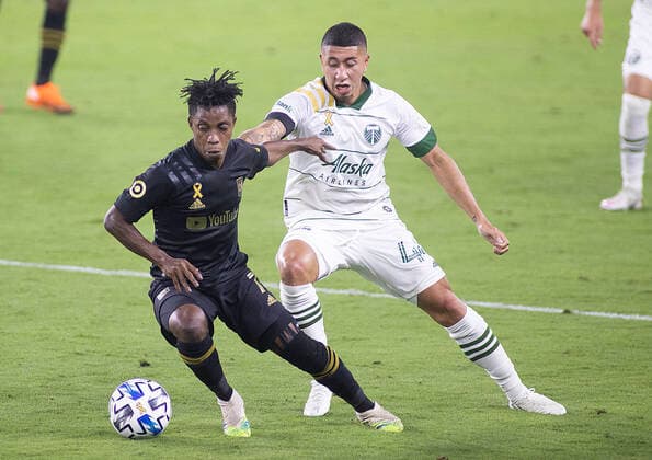 September 13, 2020, Los Angeles, California, USA: Latif Blessing 7 of the LAFC is defended by Marvin Loria 44 of the Portland Timbers during their MLS, Fussball Herren, USA game on Sunday September 13, 2020 at the Banc of California Stadium in Los Angeles, California. LAFC defeats Timbers, 4-2. JAVIER ROJAS PI Los Angeles USA - ZUMAp124 20200913_zaa_p124_021 Copyright: xJavierxRojasx