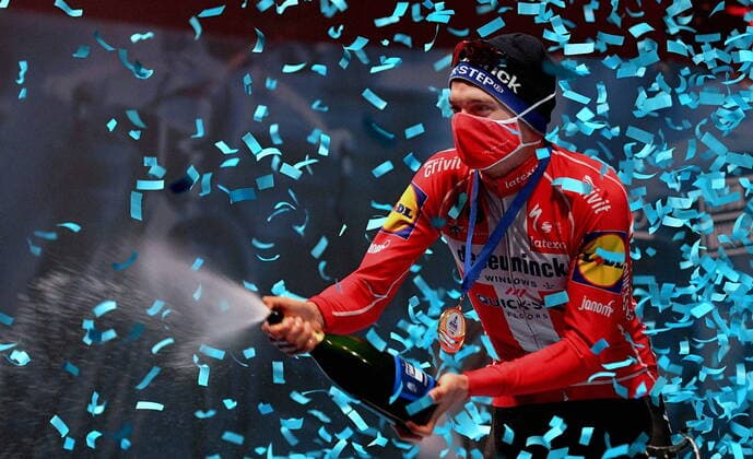 Bilder des Jahres 2021, Sport 03 März Sport Themen der Woche KW12 Sport Bilder des Tages Winner Danish Kasper Asgreen of Deceuninck - Quick-Step celebrates on the podium with champagne after the E3 Saxo Bank Classic cycling race, 203, 9km from and to Harelbeke, Friday 26 March 2021. BELGA PHOTO DAVID STOCKMAN , HARELBEKE Denmark Copyright: DAVIDxSTOCKMANx cop102 spdk20210326-175841-L