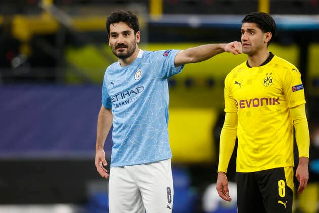 Bilder des Jahres 2021, Sport 04 April Sport Themen der Woche KW15 Dortmund, Deutschland, UEFA Champions League, Viertelfinale Borussia Dortmund - Manchester City FC 1-2 am 14. 04. 2021 im Signal-Iduna Park in Dortmund Ilka GÜNDOGAN (MCFC) li.- und Mahmoud DAHOUD (BVB) re.- Gemäß den Vorgaben der UEFA ist es untersagt, in dem Stadion und oder vom Spiel angefertigte Fotoaufnahmen in Form von Sequenzbildern und oder videoähnlichen Fotostrecken zu verwerten bzw. verwerten zu lassen.