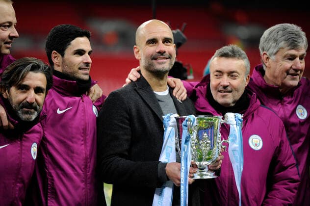 Mandatory Credit: Photo by Holly Allison Tpi Shutterstock (9421946ak) Pep Guardiola of Manchester City celebrates with his coaching team after winning the EFL Cup Final between Arsenal and Manchester City at Wembley Stadium in London. 25 Feb 2018 Arsenal v Manchester City, Premier League, Football, The Emirates Stadium, London, UK - 25 Feb 2018 EDITORIAL USE ONLY No use with unauthorised audio, video, data, fixture lists (outside the EU), club league logos or live services. Online in-match use limited to 45 images (+15 in extra time). No use to emulate moving images. No use in betting, games or single club league player publications services. Arsenal v Manchester City, Premier League, Football, The Emirates Stadium, London, UK - 25 Feb 2018 EDITORIAL USE ONLY No use with unauthorised audio, video, data, fixture lists (outside the EU), club league logos or live services. Online in-match use limited to 45 images (+15 in extra time). No use to emulate moving images. No use in betting, games or Copyright: xHollyxAllison Tpi Shutterstockx 9421946ak