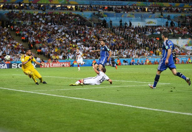 Football - 2014 FIFA World Cup, WM, Weltmeisterschaft, Fussball - Final - Germany v Argentina 13 July 2014 - FIFA World Cup - Final - Germany v Argentina - Mario Gotze of Germany scores the winning goal as Ezequiel Garay (L) and Martin Demichelis of Argentina (R) look on - Photo: Marc Atkins Offside. Rio de Janeiro Brazil Copyright: xMarcxAtkinsxOffside