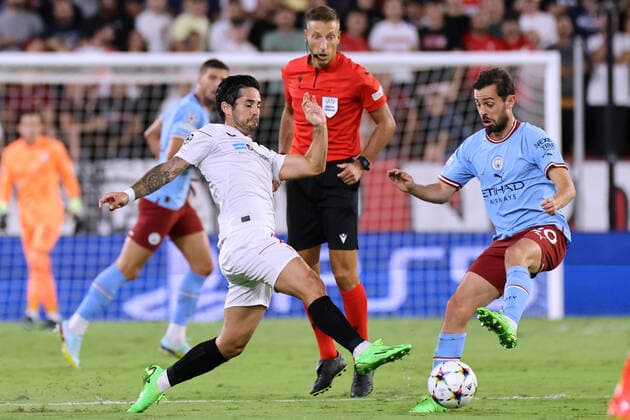 September 6, 2022, Seville, Seville, Spain: Francisco Alarcon Isco of Sevilla FC competes for the ball with Bernardo Silva of Manchester City during the UEFA Champions League Group G stage match between Sevilla FC and Manchester City at Ramon Sanchez Pizjuan on September 06, 2022 in Seville, Spain. Seville Spain - ZUMAd159 0168190507st Copyright: xJosexLuisxContrerasx