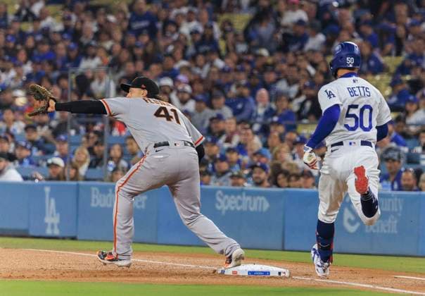 September 22, 2023, Los Angeles, California, USA: Wilmer Flores 41 of the San Francisco Giants makes an out at first base on Mookie Betts 50 of the Los Angeles Dodgers during their MLB, Baseball Herren, USA regular season game on Friday September 22, 2023 at Dodger Stadium in Los Angeles, California. Dodgers loses to Giants, 1-5. JAVIER ROJAS PI Los Angeles USA - ZUMAp124 20230922_zaa_p124_053 Copyright: xJavierxRojasx