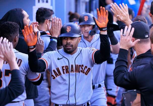 September 24, 2023, Los Angeles, California, USA: LaMonte Wade 31 of the San Francisco Giants is congratulated in the dugout after hitting a two run home run during their MLB, Baseball Herren, USA regular season game against the Los Angeles Dodgers on Sunday September 24, 2023 at Dodger Stadium in Los Angeles, California. Dodgers defeat Giants, 3-2. JAVIER ROJAS PI Los Angeles USA - ZUMAp124 20230924_zaa_p124_012 Copyright: xJavierxRojasx