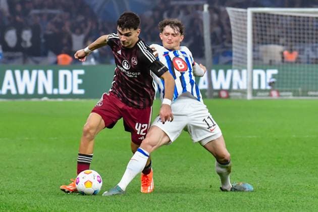 30.03.2024, xlakx, Fussball 2. Bundesliga, Hertha BSC - 1.FC Nuernberg emspor, v.l.Can Yilmaz Uzun (1.FC Nuenberg 42),Fabian Reese (Hertha BSC 11),Zweikampf, Duell, Kampf, tackle (DFL DFB REGULATIONS PROHIBIT ANY USE OF PHOTOGRAPHS as IMAGE SEQUENCES and or QUASI-VIDEO) Berlin