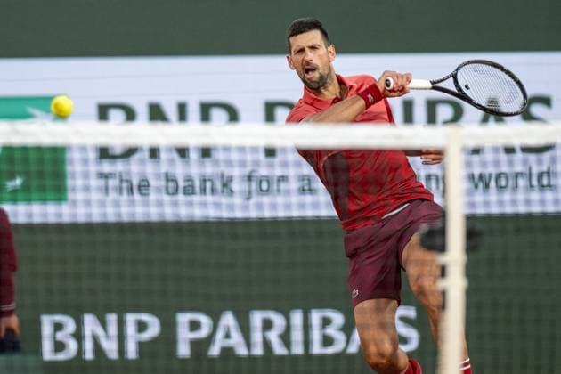 (240529) -- PARIS, May 29, 2024 -- Novak Djokovic hits a return during the men s singles first round match between Novak Djokovic of Serbia and Pierre-Hugues Herbert of France at the French tennis tournament at Roland Garros in Paris, France, on May 28, 2024. ) (SP)FRANCE-PARIS-TENNIS-FRENCH OPEN-MEN S SINGLES MengxDingbo