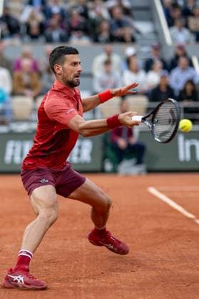 (240529) -- PARIS, May 29, 2024 -- Novak Djokovic hits a return during the men s singles first round match between Novak Djokovic of Serbia and Pierre-Hugues Herbert of France at the French tennis tournament at Roland Garros in Paris, France, on May 28, 2024. ) (SP)FRANCE-PARIS-TENNIS-FRENCH OPEN-MEN S SINGLES MengxDingbo