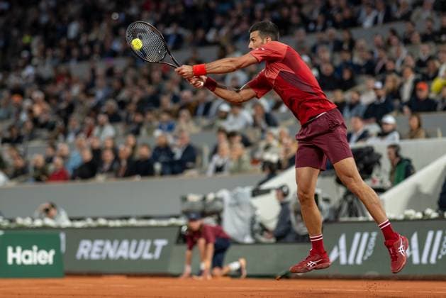 (240529) -- PARIS, May 29, 2024 -- Novak Djokovic hits a return during the men s singles first round match between Novak Djokovic of Serbia and Pierre-Hugues Herbert of France at the French tennis tournament at Roland Garros in Paris, France, on May 28, 2024. ) (SP)FRANCE-PARIS-TENNIS-FRENCH OPEN-MEN S SINGLES MengxDingbo