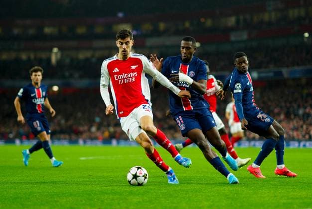 Kai Havertz of Arsenal and William Pacho of PSG Arsenal v Paris Saint-Germain, UEFA Champions League, Group Stage, Football, Emirates Stadium, London, UK, 01 Oct 2024 EDITORIAL USE ONLY No use with unauthorised audio, video, data, fixture lists, club league logos or live services. Online in-match use limited to 120 images, no video emulation. No use in betting, games or single club league player publications. Copyright: xJavierxGarcia Shutterstockx 14750159bp