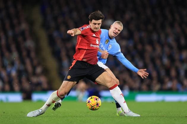 Manchester City v Manchester United, ManU 15 December 2024 - Premier League - Manchester City v Manchester United - Harry Maguire of Manchester United and Erling Haaland of Manchester City compete for the ball - Photo: Simon Stacpoole Offside. Manchester UK Copyright: xSimonxStacpoolexOffside