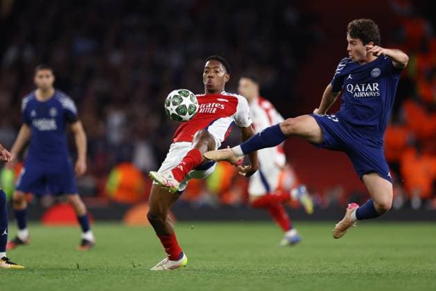 Arsenal v PSG 29 April 2025, London - UEFA Champions League Football - Semi-Final, First Leg - Arsenal v Paris Saint-Germain - Joao Neves of PSG flies in to tackle Myles Lewis-Skelly of Arsenal - Photo: Jacques Feeney Offside. London UK Copyright: xJacquesxFeeneyx xOffsidexOffside