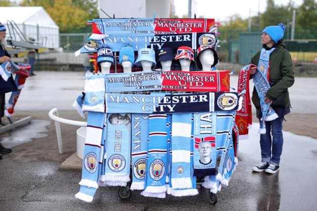 Manchester City v Manchester United, ManU 14th September 2025 - Premier League - Manchester City v Manchester United - merchandise on sale outside the Etihad Stadium including half and half scarves - Photo: Simon Stacpoole Offside. Manchester UK Copyright: xSimonxStacpoolexOffside