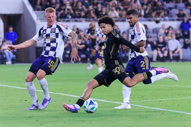 September 21, 2025, Los Angeles, California, USA: David Martinez 30 of the Los Angeles Football Club makes a goal attempt as Justen Glad 15 and DeAndre Yedlin 2 of Real Salt Lake defend during their regular season MLS, Fussball Herren, USA game on Sunday September 21, 2025 at the BMO Stadium in Los Angeles, California. LAFC defeat RSL, 4-1. ARIANA RUIZ PI Los Angeles USA - ZUMAp124 20250921_zaa_p124_039 Copyright: xArianaxRuizx