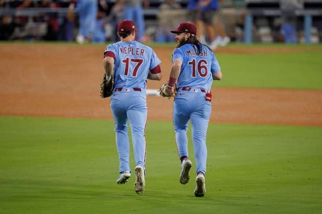 October 8, 2025, Los Angeles, California, USA: Max Kepler 17 of the Philadelphia Phillies is congratulated by Brandon Marsh 16 after catching a ball hit by Shohei Ohtani 17 of the Los Angeles Dodgers in the 9th inning during their MLB, Baseball Herren, USA National League Division Series Game 3 on Wednesday October 8, 2025 at Dodger Stadium in Los Angeles, California. Dodgers lose to Phillies, 2-8. ARMANDO ARORIZO PI Los Angeles USA - ZUMAp124 20251008_zaa_p124_033 Copyright: xArmandoxArorizox