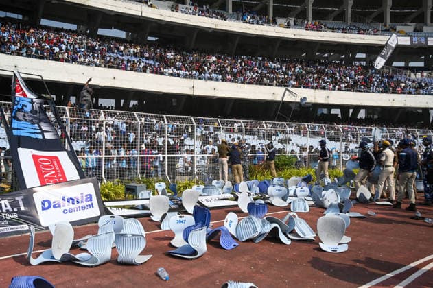 KOLKATA, INDIA - DECEMBER 13: Angry fans vandalise banners, throw bottles, ripped up seats and threw them on the pitch after Argentina football star Lionel Messi s early departure from the Salt Lake Stadium during his India Tour, on December 13, 2025 in Kolkata, India. Football fans were angry that, despite buying tickets at steep prices, they were not even able to catch a glimpse of their favourite star. Lionel Messi is on his G.O.A.T. India tour 2025, and he arrived in Kolkata in the early hours of Saturday (December 13, 2025). (Photo by Samir Jana Hindustan Times ) Argentina Football Star Lionel Messi Visits Kolkata: Upset Fans Vandalise Salt Lake Stadium