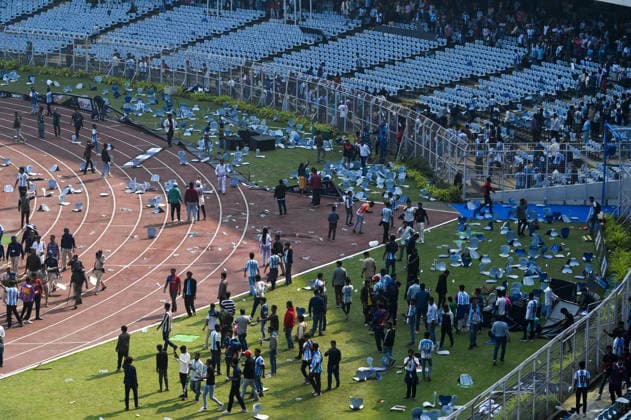KOLKATA, INDIA - DECEMBER 13: Angry fans vandalise banners, throw bottles, ripped up seats and threw them on the pitch after Argentina football star Lionel Messi s early departure from the Salt Lake Stadium during his India Tour, on December 13, 2025 in Kolkata, India. Football fans were angry that, despite buying tickets at steep prices, they were not even able to catch a glimpse of their favourite star. Lionel Messi is on his G.O.A.T. India tour 2025, and he arrived in Kolkata in the early hours of Saturday (December 13, 2025). (Photo by Samir Jana Hindustan Times ) Argentina Football Star Lionel Messi Visits Kolkata: Upset Fans Vandalise Salt Lake Stadium