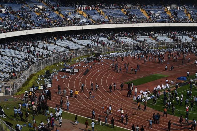 KOLKATA, INDIA - DECEMBER 13: Angry fans vandalise banners, throw bottles, ripped up seats and threw them on the pitch after Argentina football star Lionel Messi s early departure from the Salt Lake Stadium during his India Tour, on December 13, 2025 in Kolkata, India. Football fans were angry that, despite buying tickets at steep prices, they were not even able to catch a glimpse of their favourite star. Lionel Messi is on his G.O.A.T. India tour 2025, and he arrived in Kolkata in the early hours of Saturday (December 13, 2025). (Photo by Samir Jana Hindustan Times ) Argentina Football Star Lionel Messi Visits Kolkata: Upset Fans Vandalise Salt Lake Stadium