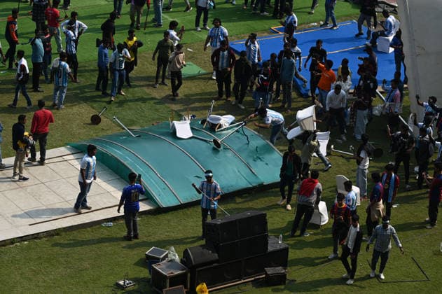 KOLKATA, INDIA - DECEMBER 13: Angry fans vandalise banners, throw bottles, ripped up seats and threw them on the pitch after Argentina football star Lionel Messi s early departure from the Salt Lake Stadium during his India Tour, on December 13, 2025 in Kolkata, India. Football fans were angry that, despite buying tickets at steep prices, they were not even able to catch a glimpse of their favourite star. Lionel Messi is on his G.O.A.T. India tour 2025, and he arrived in Kolkata in the early hours of Saturday (December 13, 2025). (Photo by Samir Jana Hindustan Times ) Argentina Football Star Lionel Messi Visits Kolkata: Upset Fans Vandalise Salt Lake Stadium