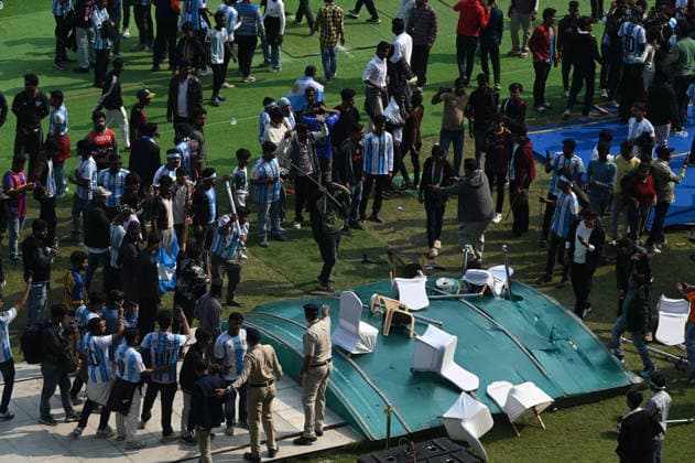KOLKATA, INDIA - DECEMBER 13: Angry fans vandalise banners, throw bottles, ripped up seats and threw them on the pitch after Argentina football star Lionel Messi s early departure from the Salt Lake Stadium during his India Tour, on December 13, 2025 in Kolkata, India. Football fans were angry that, despite buying tickets at steep prices, they were not even able to catch a glimpse of their favourite star. Lionel Messi is on his G.O.A.T. India tour 2025, and he arrived in Kolkata in the early hours of Saturday (December 13, 2025). (Photo by Samir Jana Hindustan Times ) Argentina Football Star Lionel Messi Visits Kolkata: Upset Fans Vandalise Salt Lake Stadium
