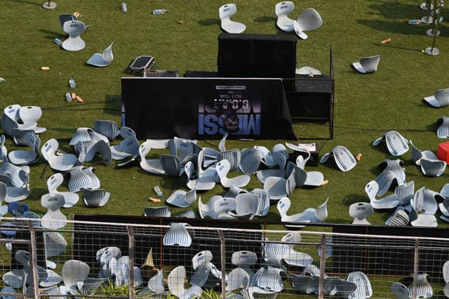 KOLKATA, INDIA - DECEMBER 13: Angry fans vandalise banners, throw bottles, ripped up seats and threw them on the pitch after Argentina football star Lionel Messi s early departure from the Salt Lake Stadium during his India Tour, on December 13, 2025 in Kolkata, India. Football fans were angry that, despite buying tickets at steep prices, they were not even able to catch a glimpse of their favourite star. Lionel Messi is on his G.O.A.T. India tour 2025, and he arrived in Kolkata in the early hours of Saturday (December 13, 2025). (Photo by Samir Jana Hindustan Times ) Argentina Football Star Lionel Messi Visits Kolkata: Upset Fans Vandalise Salt Lake Stadium