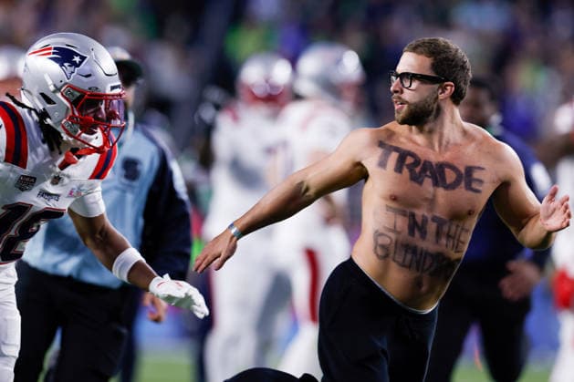 A shirtless fan runs on the field during the fourth quarter of Super Bowl LX between the New England Patriots and the Seattle Seahawks at Levi s Stadium in Santa Clara, California on Sunday, February 8, 2026.  SBP20260208192 JOHNxANGELILLO