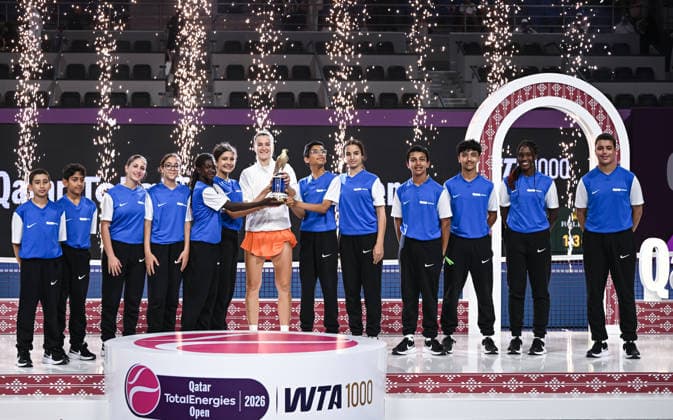 Qatar TotalEnergies Open 2026 Final, victory ceremony, winner Karolina Muchova (CZE) with ball kids Karolina Muchova (CZE)
