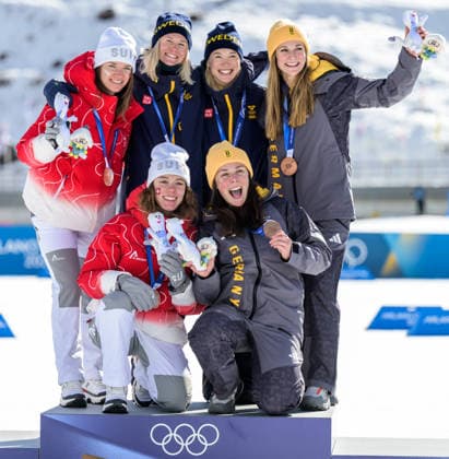 260218 Nadja Kälin and Nadine Faehndrich of Switzerland, Jonna Sundling and Maja Dahlqvist of Sweden and Laura Gimmler and Coletta Rydzek of Germany celebrate on the podium after the women s free technique team sprint cross-country skiing final during day 12 of the 2026 Winter Olympics on February 18, 2026 in Val di Fiemme. Photo: Jon Olav Nesvold BILDBYRAN COP 217 MT0993 skidor cross-country skiing langrenn Olympic Games, Olympische Spiele, Olympia, OS olympics winter olympics os ol olympiska spel vinter-os olympiske leker milano cortina 2026 milan cortina 2026 milano cortina 2026 olympic games milano cortina 2026 winter olympic games milano cortina-os milano cortina-ol vinter-ol 12 bbeng teamsprint jubel sweden sverige Copyright: JONxOLAVxNESVOLD BB260218JE078
