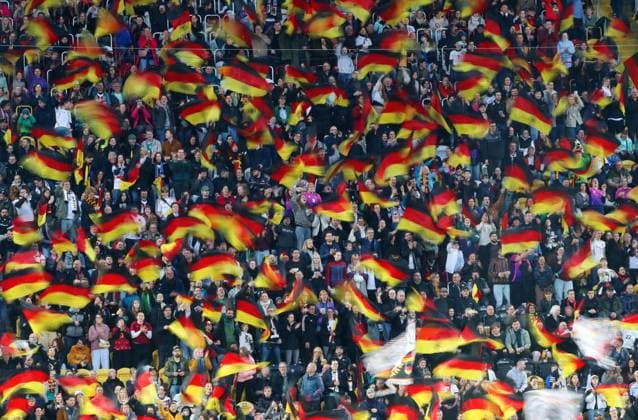 GER, Fussball, Frauen, WM Qualifikation, Deutschland - Slowenien 03.03.2026, Dresden, Rudolf-Harbig-Stadion, GER, WM Qualifikation, Frauen-Laenderspiel, Gruppenphase, Gruppe D, Spiel 1 von 6 Deutschland - Slowenien im Bild: Fans schwenken Deutschland-Fahnen, ein Meer in schwarz rot gold DFL regulations prohibit any use of photographs as image sequences and or quasi-video