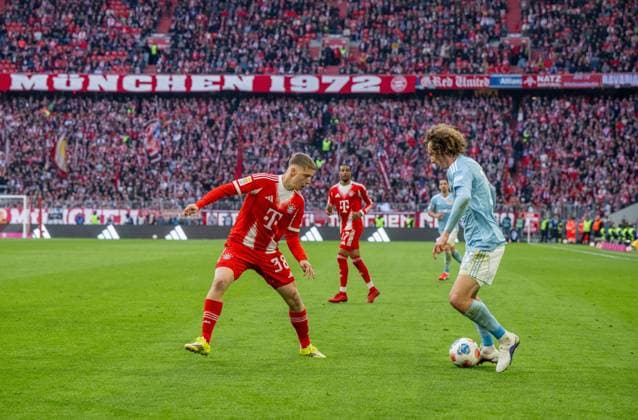 Fußball, Herren, Saison 2025 2026, 1. Bundesliga (27. Spieltag), FC Bayern München - 1. FC Union Berlin, v. l. Erblin Osmani (Bayern München), Alex Kral (1. FC Union Berlin), 21.03. 2026, Copyright: xMatthiasxKochx