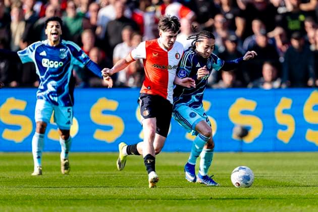 ROTTERDAM - AFC Ajax Amsterdam player Kian Fitz-Jim, SC Feyenoord Rotterdam player Leo Sauer during the Dutch Vriendenloterij Eredivisie match between Feyenoord and Ajax at De Kuip on March 22, 2026 in Rotterdam, the Netherlands. (Photo by DeFodi Images) -