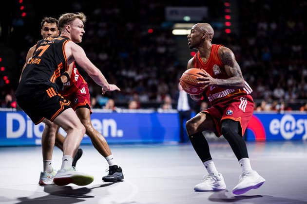 MUNICH, GERMANY - MAY 03: Isiaha Mike (FC Bayern Muenchen, 22) controls the ball against Lars Thiemann (Rasta Vechta, 21) during the easyCredit Basketball Bundesliga match between FC Bayern Muenchen vs. Rasta Vechta at BMW Park on matchday 32 of the easyCredit Basketball Bundesliga on May 03, 2026 in Munich, Germany. Bavaria Germany Copyright: xSteffiexWunderlx