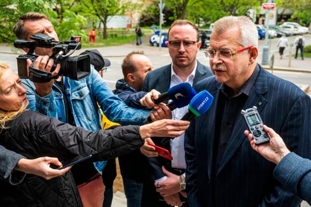 SK Slavia Praha chairman of the board of directors Jaroslav Tvrdik, right, speaks to journalist as he arrives for meeting of the Football League Association disciplinary committee, which will deliver a verdict against Slavia club, which was prosecuted for serious breach of its duties as a promoter after the derby with Sparta was not played, 12 May 2026, Prague. (CTKxPhoto VitxSimanek) CTKPhotoP2026051203600  CTKPhotoP2026051203600