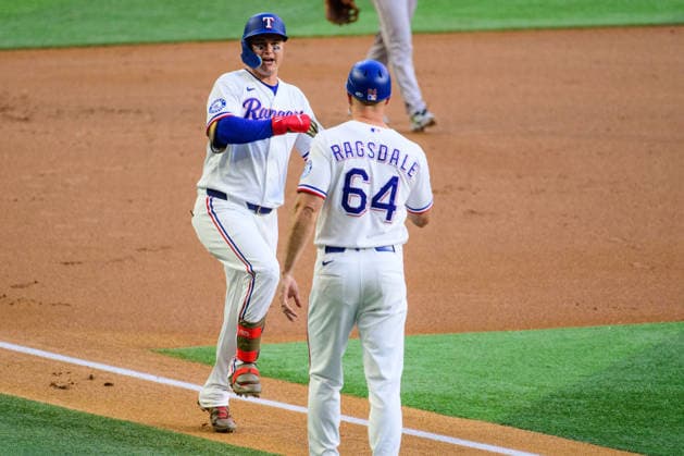 May 12, 2026, Arlington, Texas, USA: Texas Rangers designated hitter JOC PEDERSON (3) celebrates with Texas Rangers third base coach COREY RAGSDALE (64) after hitting a homerun during the first inning of the game between the Texas Rangers and the Arizona Diamondbacks. Texas Rangers Win 7-4  - ZUMAm348 20260512_znp_m348_004 Copyright: xLuisxRevillaxMatax