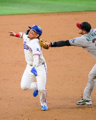 May 12, 2026, Arlington, Texas, USA: Texas Rangers left fielder ALEJANDRO OSUNA (19) is tagged out while running to third base by Arizona Diamondbacks third baseman NOLAN ARENADO (28) during the game between the Texas Rangers and the Arizona Diamondbacks Texas Rangers Win 7-4  - ZUMAm348 20260512_znp_m348_008 Copyright: xLuisxRevillaxMatax