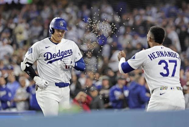 Baseball: Giants vs. Dodgers Los Angeles Dodgers designated hitter Shohei Ohtani (L) is greeted by his teammate Teoscar Hernandez after hitting a solo home run in the third inning of a baseball game against the San Francisco Giants at Dodger Stadium in Los Angeles on May 12, 2026.  A14AA0005549125P