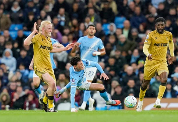 Manchester, England, 13th May 2026. Will Hughes of Crystal Palace fouls Phil Foden of Manchester City during the Manchester City vs Crystal Palace Premier League match at the Etihad Stadium, Manchester. Picture credit should read: Andrew Yates Sportimage EDITORIAL USE ONLY. No use with unauthorised audio, video, data, fixture lists, club league logos or live services. Online in-match use limited to 120 images, no video emulation. No use in betting, games or single club league player publications. SPI_029_AY_Man_City_Palace SPI-4799-0029