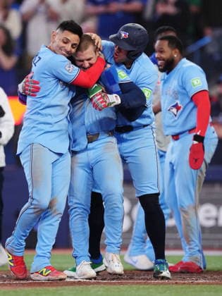 May 13, 2026, Toronto, On, CANADA: Toronto Blue Jays Daulton Varsho (second left) celebrates his walk-off grand slam against the Tampa Bay Rays with Andres Gimenez (left) and George Springer during 10th inning MLB, Baseball Herren, USA baseball action in Toronto on Wednesday, May 13, 2026. Canada News - May 13, 2026  - ZUMAc35_ 20260513_zaf_c35_194 Copyright: xNathanxDenettex