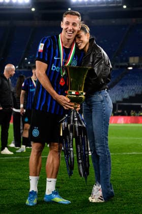 Davide Frattesi of FC Internazionale and Eleonora Piredda celebrate with the trophy at the end of the 2025 2026 Coppa Italia football final between SS Lazio and FC Internazionale at Stadio Olimpico in Rome (Italy), May 13, 2026. AndreaxStaccioli